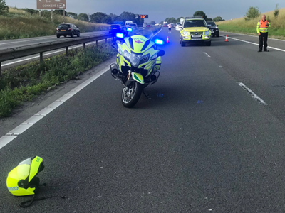 Police motor bike at scene of a road incident