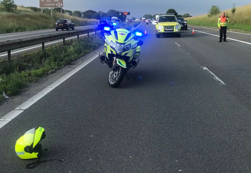 Police motor bike at scene of a road incident